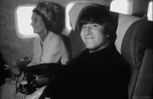 John-being-cheeky-in-the-plane-the-beatles-41011791-497-322